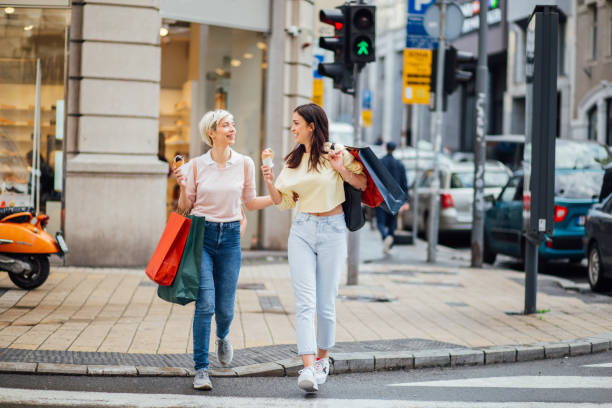 istock Two girls going back from shopping 1170729002