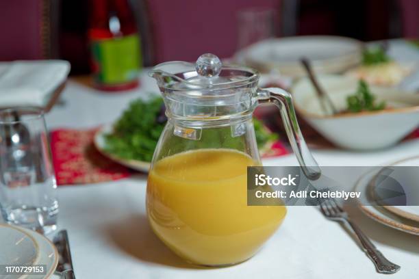 https://media.istockphoto.com/id/1170729153/photo/orange-juice-in-pitcher-glass-jar-of-organic-fresh-orange-smoothie-juice-with-reflection.jpg?s=612x612&w=is&k=20&c=M5krMBf-pEdEIySrpS2zx-Avdjkgwpo68X6lILlf_GM=