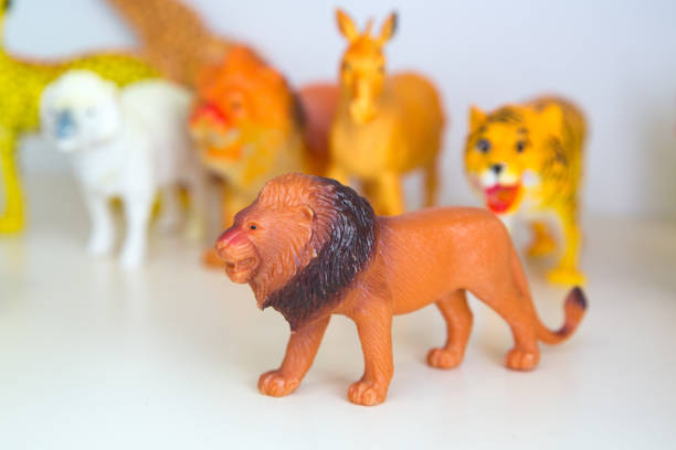 istock rubber lion on white background with clipping path . Brown Plastic Toy Lion on White Background . 1170729692