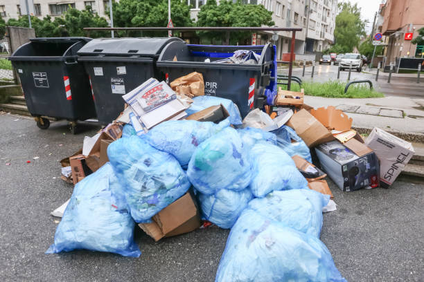 Garbage bags Zagreb, Croatia - May 29, 2019 : A pile of garbage bags next to a garbage containers in the street of Zagreb, Croatia overflowing trash dumpster stock pictures, royalty-free photos & images
