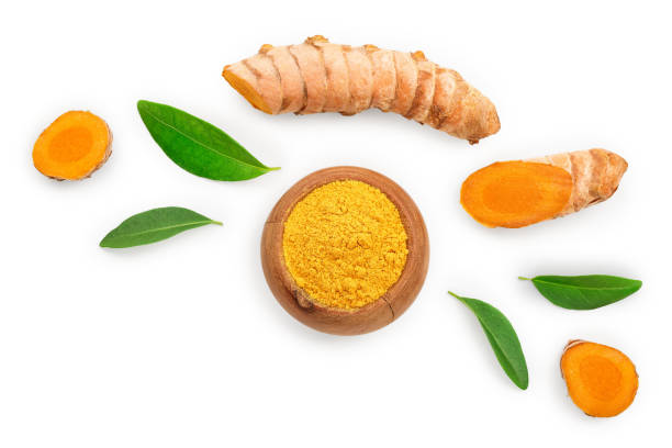 istock Turmeric powder and turmeric root isolated on white background with copy space for your text. Top view. Flat lay 1170730460