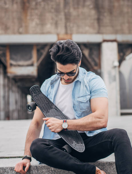 istock Muscular man with skateboard 1170733024
