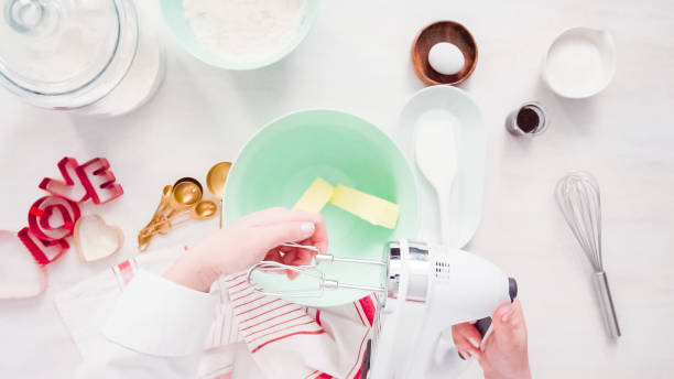 istock Mixing sugar cookies dough in mixing bowl. 1170733143