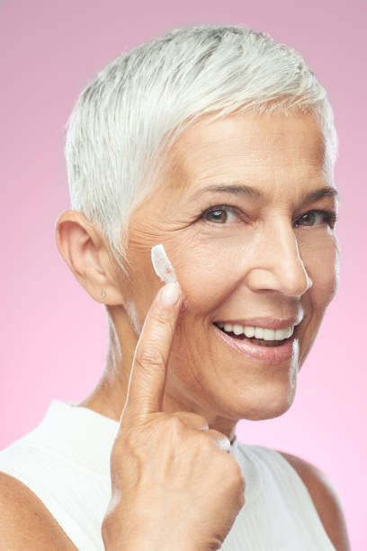 istock Woman putting anti age cream. 1170734229
