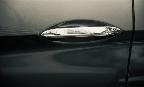 istock Metallic door knobs of a black car unique photo 1170736657