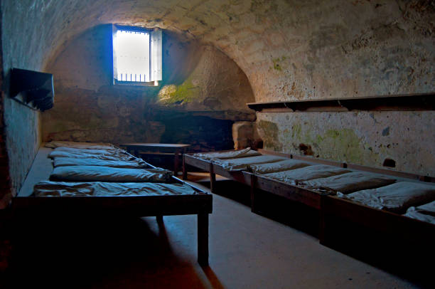 Old original barracks in a dark room of the Castillo de San Marcos fort, Saint Augustine, Florida, USA.