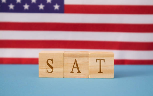 istock SAT Exam in WOoden blook letters on US flag 1170737282
