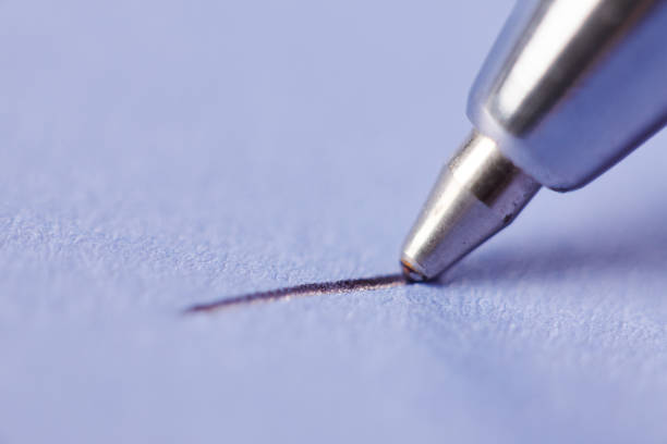 istock Close-up silver ballpoint pen drawing a line 1170738046