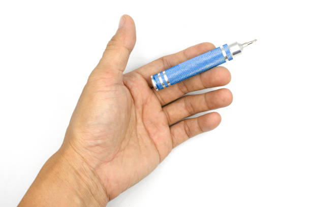 istock Male hand holding small screwdriver, Precision screwdriver, man hand isolated on white background 1170738461