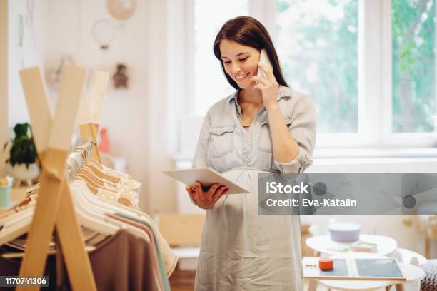Young Woman In A Shopping Store Stock Photo - Download Image Now - Baby Shop, Store, Crib