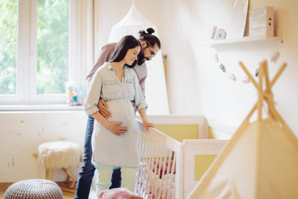 Young couple in a shopping store Young couple in a shopping store nursery bedroom stock pictures, royalty-free photos & images