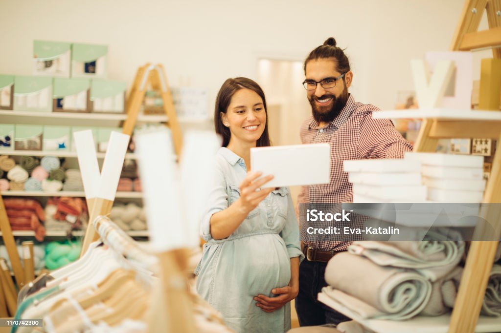Young couple in a shopping store Pregnant Stock Photo