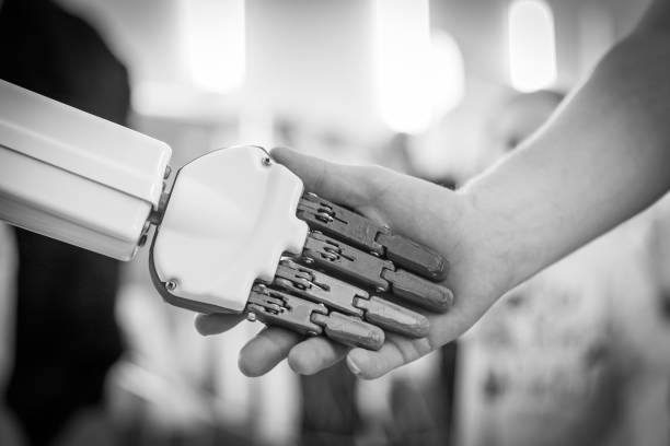 istock close up of man shaking hands with a robot 1170742416