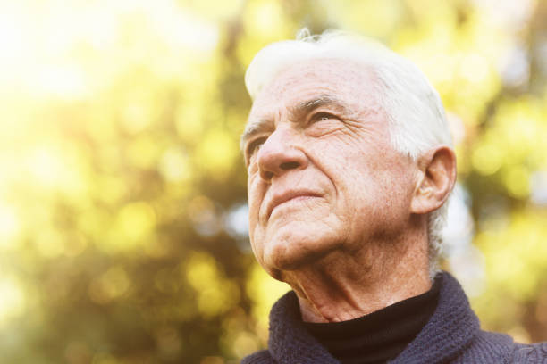 istock Senior man looks thoughtfully out from a garden 1170744324