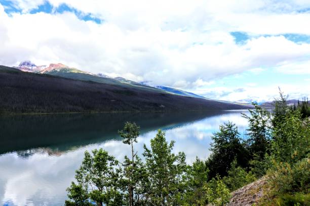 istock Mirror lake, blue sky and mountains 1170744421