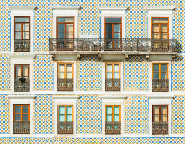 Facade of a building covered with traditional Portuguese tiles. Typical building decoration in Lisbon, Portugal stock photo