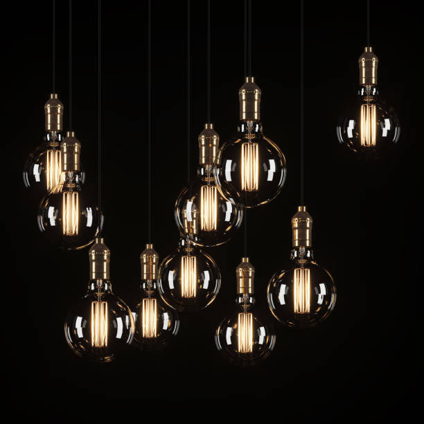istock Decorative vintage light bulbs in Edison style on a black background. 3D rendering. 1170745711