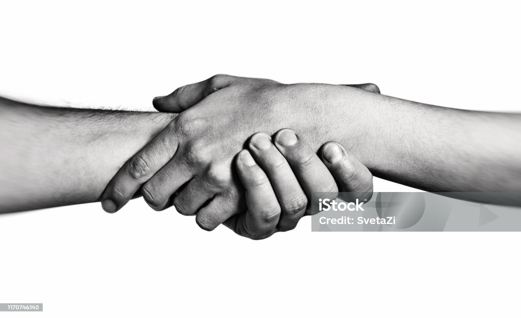 Concept of salvation Concept of salvation. Image of the hands of two people at the time of rescue (help). Black and white. Adult Stock Photo