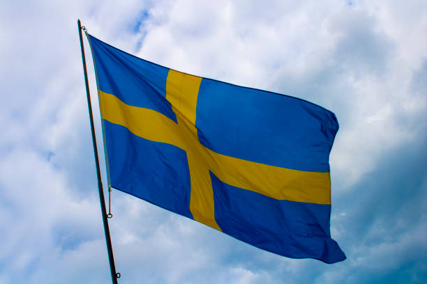 шведский флаг - day sky swedish flag banner стоковые фото и изображения