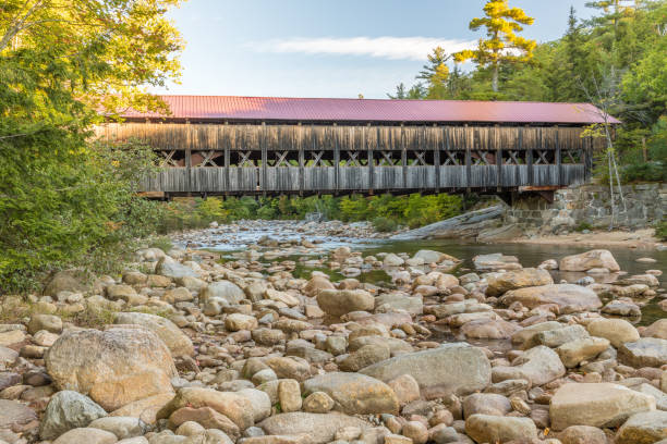 istock Covered Bridge over River in New Hampshire 1170751708