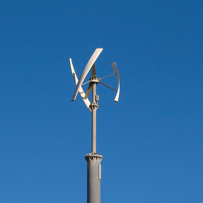 Vertical axis wind turbine. Wind generator vertical. Windmill modern, energy of future