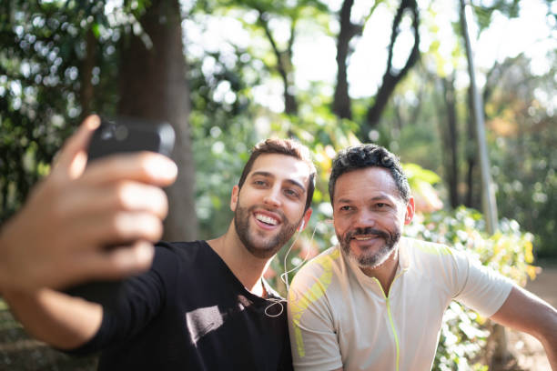 istock Two men taking a selfie in park 1170755167