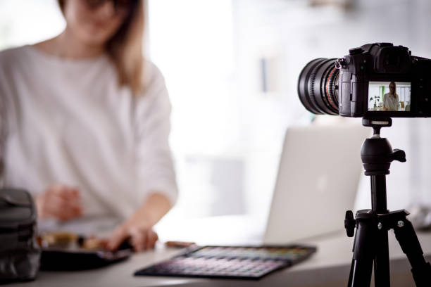 istock Beauty blogger filming a video tutorial for her social media and internet audience 1170755300