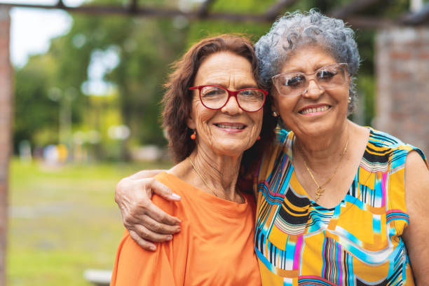 istock Retired friends enjoying sunny day in public park 1170755513