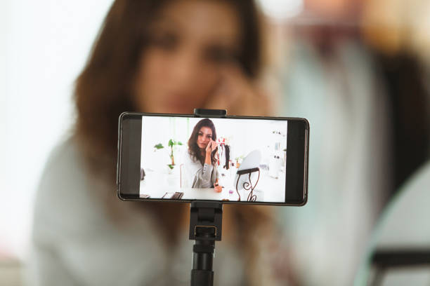 istock Young beauty blogger doing a live stream while applying make up 1170756631