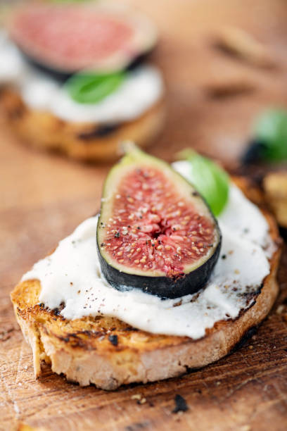 istock Fresh figs with ricotta cheese and fresh basil. 1170757000