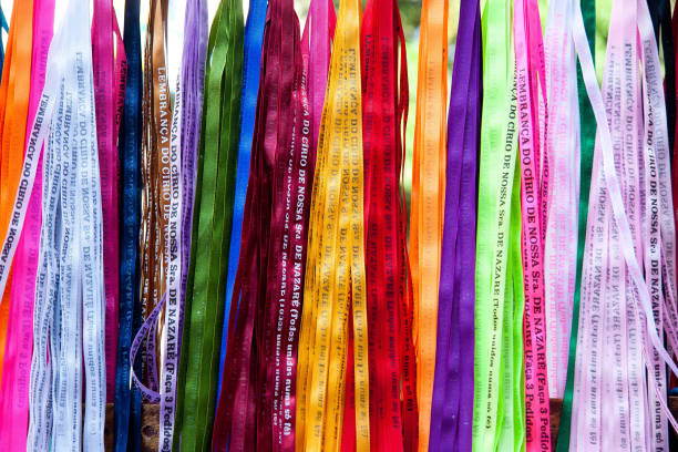 Religious ribbons. Colorful bracelet. Belem / Para / Brazil. Translation: "Reminder of the candle of Our Lady of Nazareth (make 3 requests)." cirio de nazare stock pictures, royalty-free photos & images