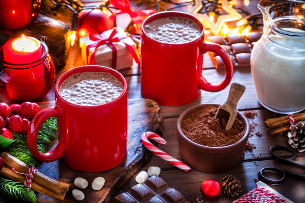 istock Two homemade hot chocolate mugs on Christmas table 1170760415