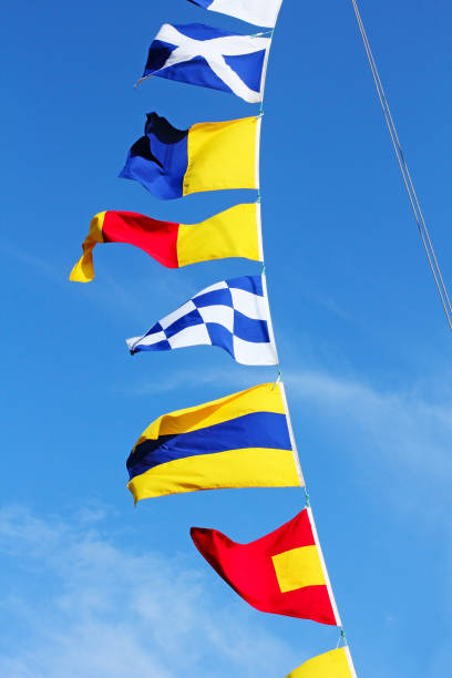 istock Marine signal flags set on a blue sky background. 1170760700
