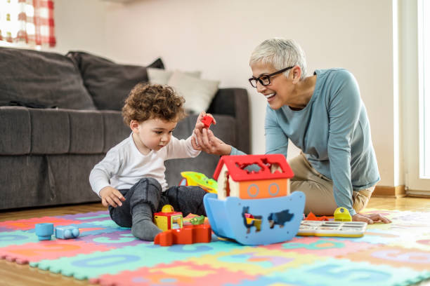istock Grandmother playing with her grandson 1170763403