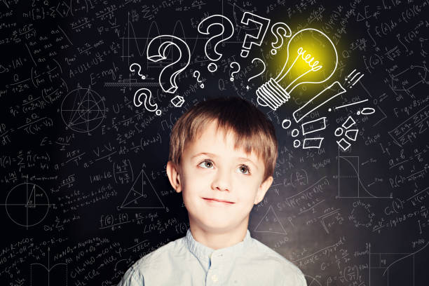 istock School boy with lightbulb on background. Science idea concept wi 1170763448