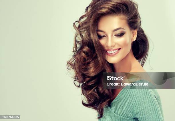 Young Brown Haired Woman Is Touching Softly Owne Hair Hair Care Stock Photo  - Download Image Now - iStock