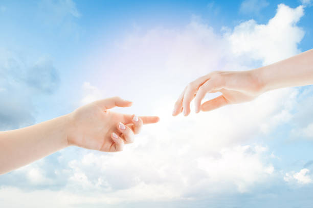 istock Hands and clouds. Helping, giving and taking hand 1170764976