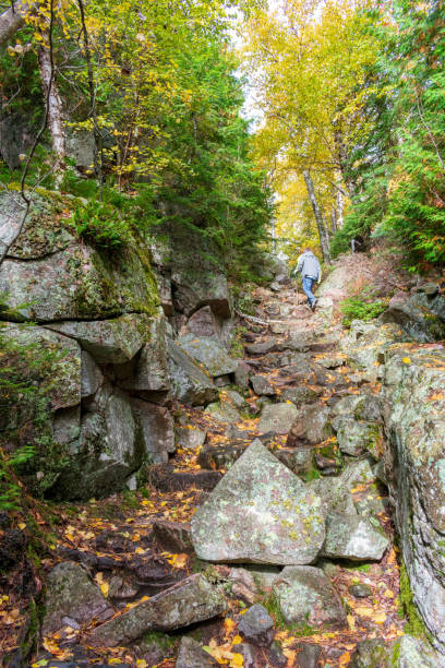 Man hiking up rugged rocky trail