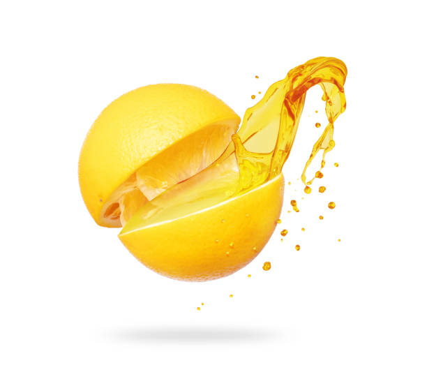 istock Juice splashes out of a cut orange on a white background 1170767326