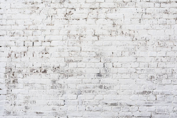Empty Old Brick Wall Texture. Painted Distressed Wall Surface. Grungy Wide Brickwall. Shabby Building Facade With Damaged Plaster.