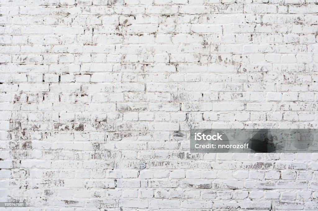 Empty Old Brick Wall Texture. Painted Distressed Wall Surface. Grungy Wide Brickwall. Shabby Building Facade With Damaged Plaster. Empty Old Brick Wall Texture. Painted Distressed Wall Surface. Grungy White Brickwall. Shabby Building Facade With Damaged Plaster. Abstract Web Banner. Copy Space. Brick Wall Stock Photo