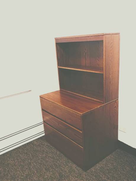 Basic Dresser & Bookshelf in Nondescript Undecorated White Box Dorm Room