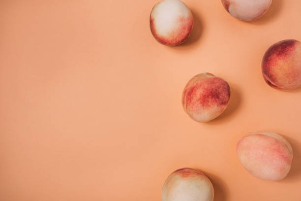 A few peaches on a pastel background.