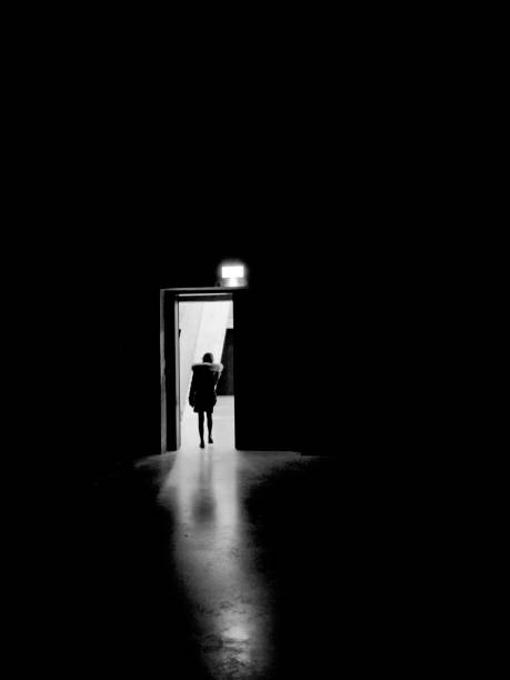 istock Human silhouette crossing a door 1170769719