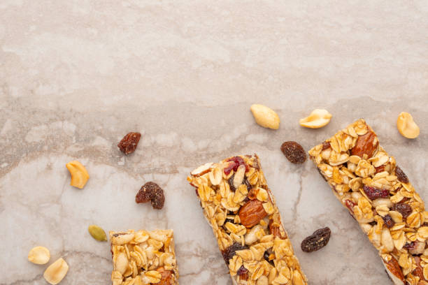 istock granola bars with nuts on a light background with space for design, horizontal photo, diet, proper nutrition 1170770676