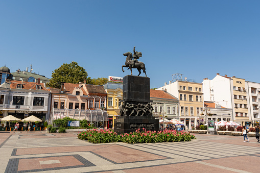 Nis, Serbia - August 28, 2019: City square with the big monument and old retro buildings in downtown on a sunny summer clear day in the city of Nis, Serbia, Europe