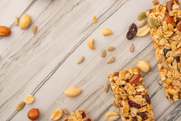 istock granola bars with nuts on a light background with space for design, horizontal photo, diet, proper nutrition 1170771898