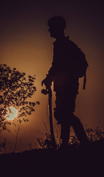 istock Longboarder silhouetted in sunset stock photo 1170775388