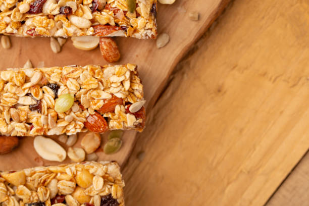 istock granola bars on a wooden background with space for design, horizontal photo 1170777948