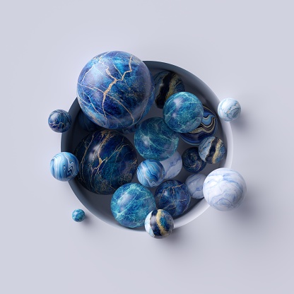 3d abstract background, assorted blue marble balls inside round white niche